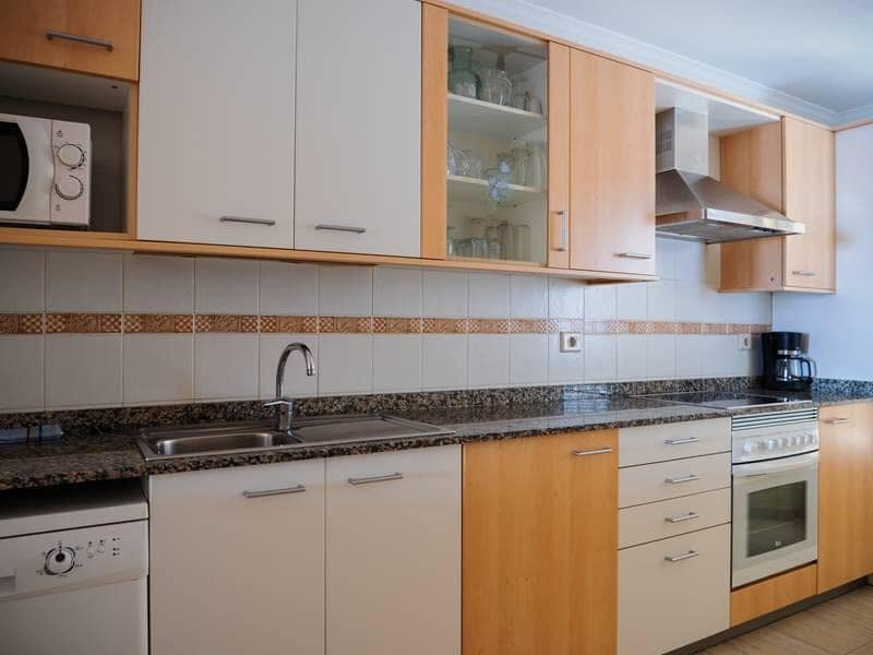 Kitchen with dishwasher, oven and coffee maker