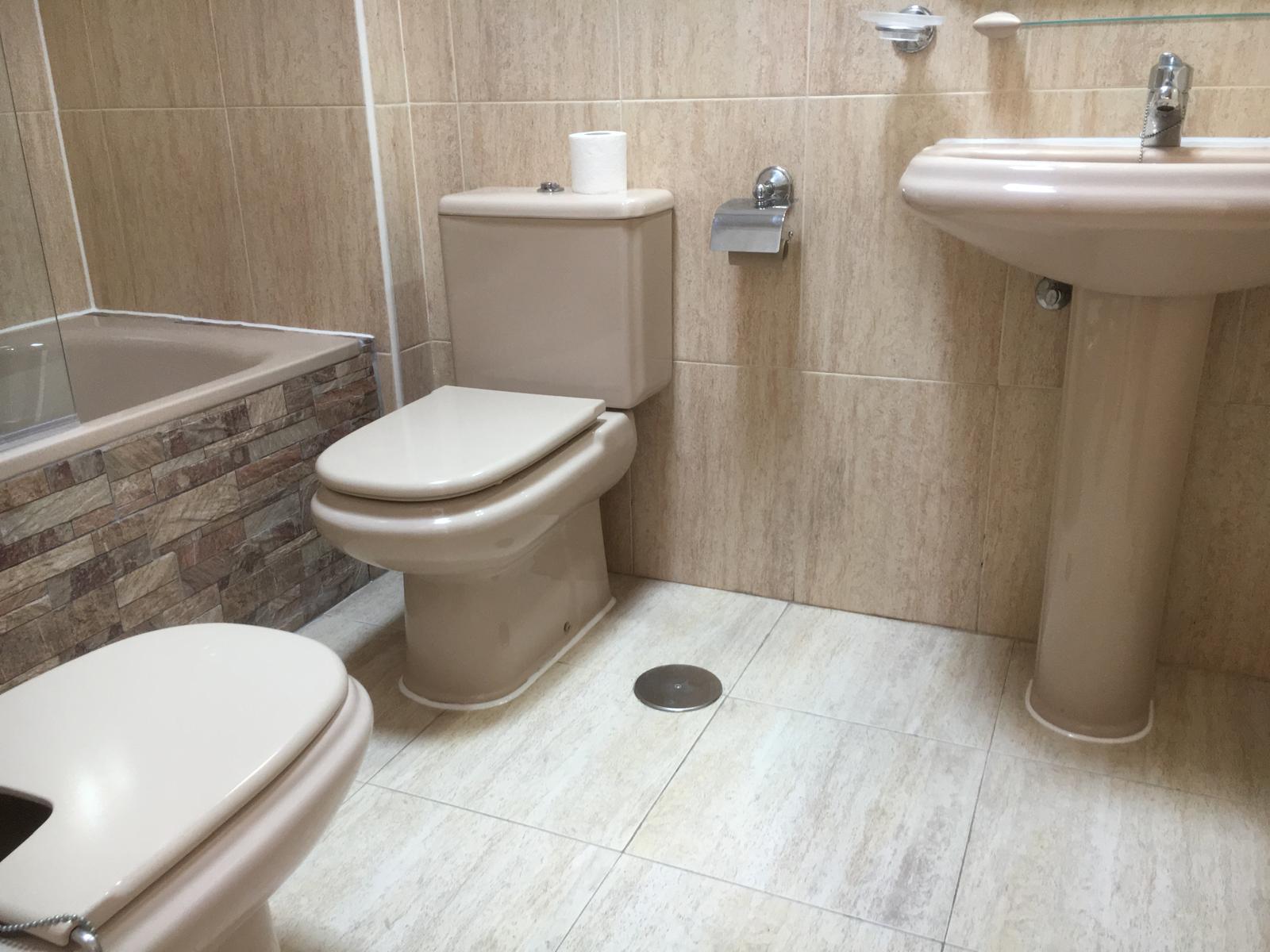 Bathroom with bath and shower